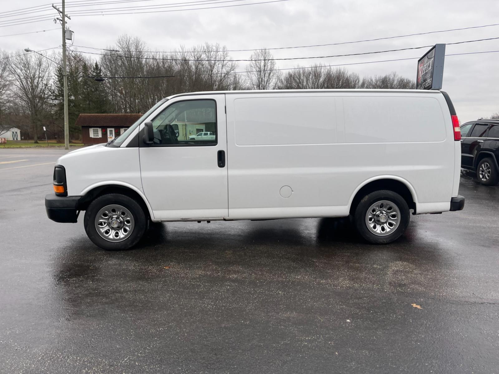 2014 White /Neutral Chevrolet Express 1500 AWD Cargo (1GCSHAF4XE1) with an 5.3L V8 OHV 16V FFV engine, 4-Speed Automatic transmission, located at 547 E. Main St., Orwell, OH, 44076, (440) 437-5893, 41.535435, -80.847855 - This 2014 Chevrolet Express 1500 Cargo Van with a 5.3L Vortec V8 engine and all-wheel drive is a versatile and robust vehicle designed to meet various transportation and towing needs. It comes equipped with convenient features such as power windows, power locks, and a backup camera for safer reversi - Photo #13